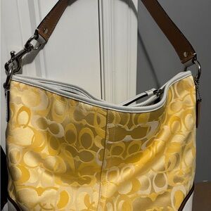 2010 Coach Yellow large hobo style bag + will come with a wristlet